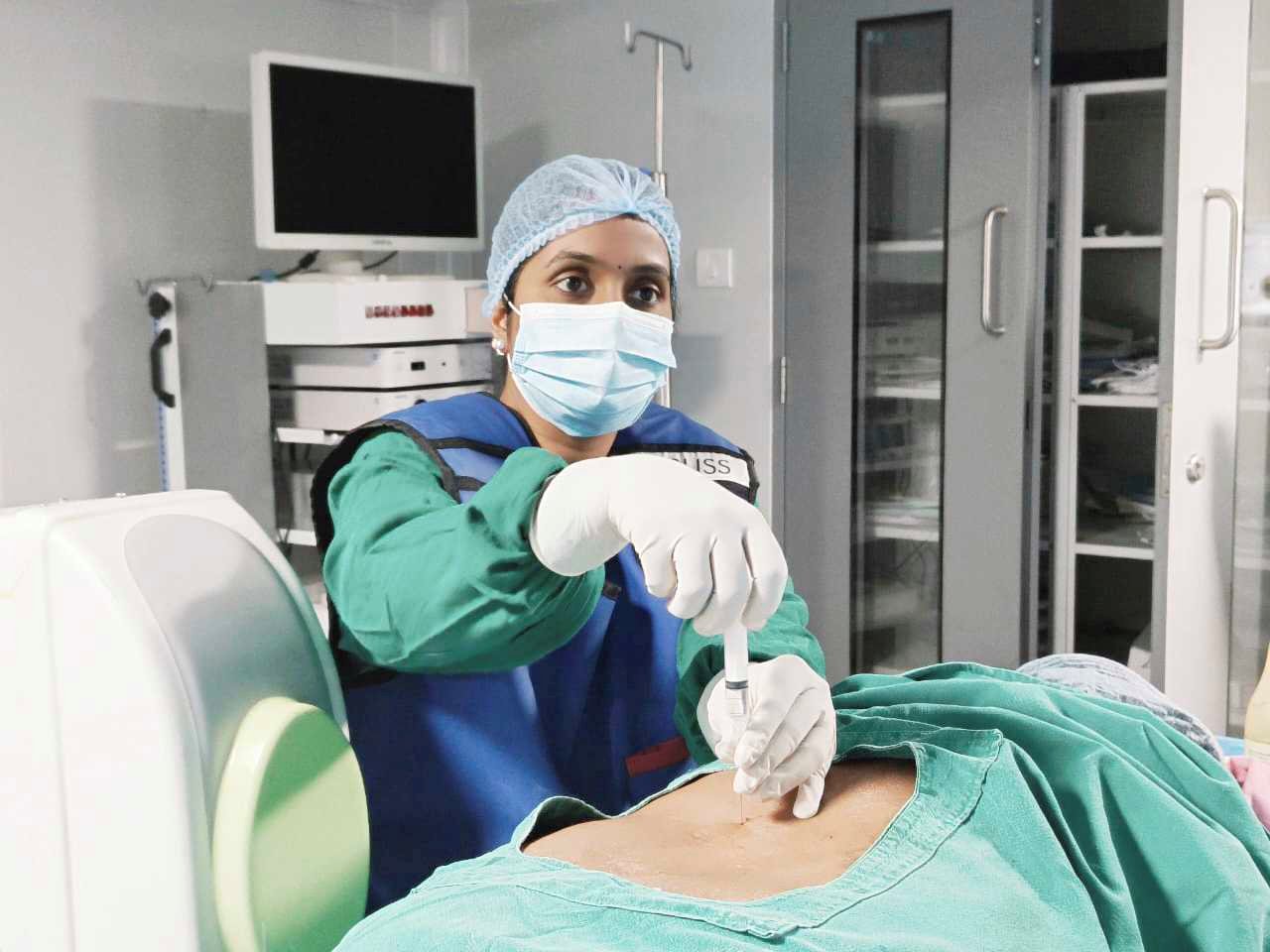 A doctor performing an ultrasound-guided procedure